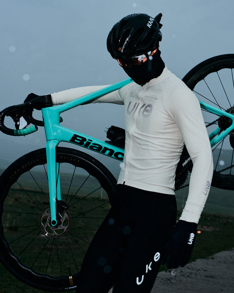 Cyclist riding in cold wet and windy weather